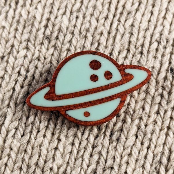 Planet saturn wooden pin up close